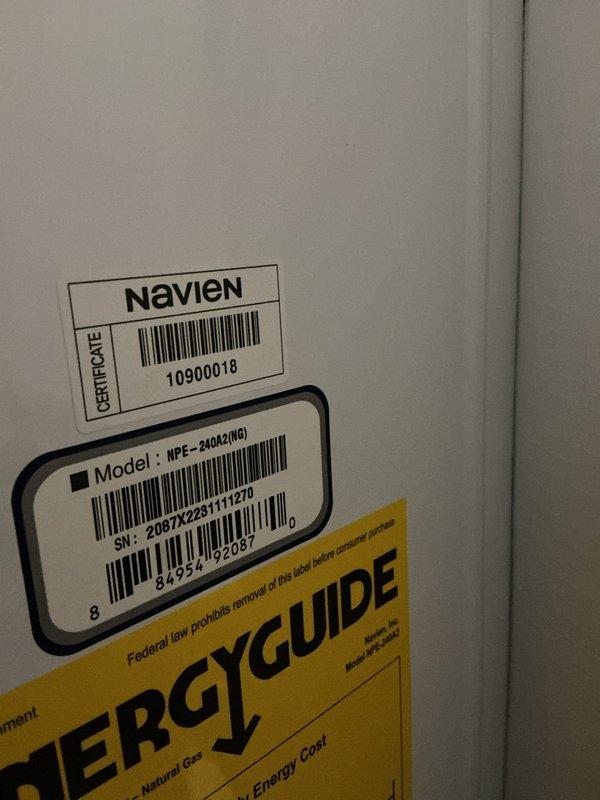 Serviced a 2-year-old Navien NPE-240A2 tankless water heater unit, performing routine maintenance within the requested morning timeframe. Completed standard system flush procedures and verified proper operation of all components, with the customer providing payment via check upon completion.