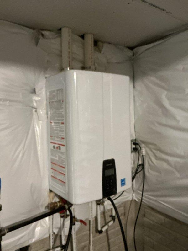 Serviced a 2-year-old Navien NPE-240A2 tankless water heater unit, performing routine maintenance within the requested morning timeframe. Completed standard system flush procedures and verified proper operation of all components, with the customer providing payment via check upon completion.