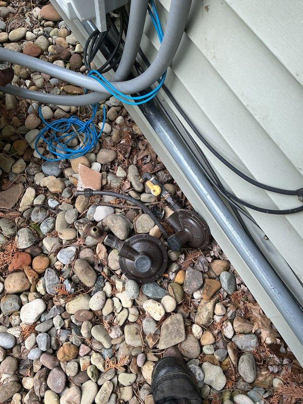 Performed initial startup and commissioning of newly installed tankless water heater system. Conducted thorough inspection of exterior utility connections, verifying proper installation of insulated gas lines secured with appropriate fasteners at building foundation. Confirmed all pipe penetrations through siding were properly sealed and weatherproofed. Examined interior mechanical components including gas valve assembly, blower motor housing, and ignition system. Verified all electrical connections were secure and properly terminated. Tested gas pressure at inlet and confirmed NG (natural gas) supply specifications met manufacturer requirements. Walked through system operation and controls with occupant, demonstrating temperature adjustment procedures and basic maintenance requirements for optimal performance.