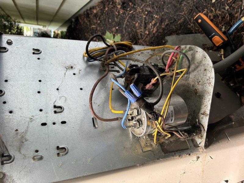 Completed scheduled MVP cooling maintenance visit on residential HVAC system. Performed comprehensive inspection of outdoor condensing unit, including capacitor connections and electrical components, noting weathering and age-related corrosion on wire terminals. Inspected indoor air handler unit with associated PVC venting system and ductwork connections. All components found operational with documentation of current equipment condition for maintenance records.