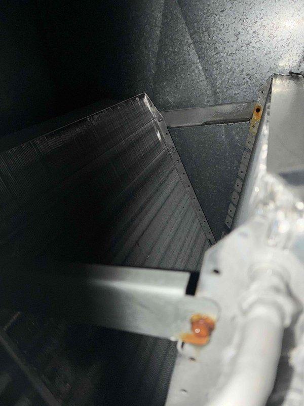 Completed scheduled MVP cooling maintenance visit on residential air conditioning system. Performed comprehensive inspection of outdoor condenser unit and indoor evaporator coil, documenting equipment condition through photographic records. Both heat exchanger components showed normal operational wear with minor dust and debris accumulation typical of routine outdoor exposure. Unit confirmed to be in functional operating condition with all primary components performing within acceptable parameters.