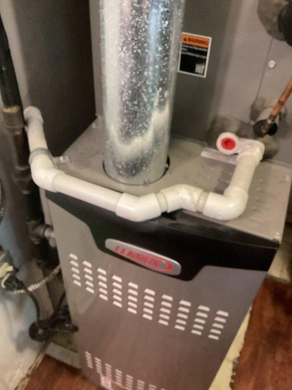 Responded to service call for humming noise from condensate pump. Upon inspection, found Lennox air handler unit with properly functioning condensate removal system, though pump motor was producing audible humming during operation. Verified pump operation, checked drainage lines and connections for proper flow, and confirmed system was removing condensate effectively despite noise concern. Unit operating within normal parameters with no immediate service required at time of visit.