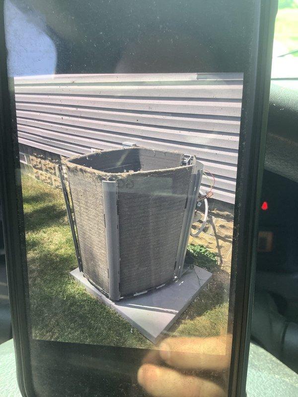 Responded to service call for air conditioning unit experiencing overheating issues and operational problems due to excessive dirt accumulation. Upon inspection, found outdoor condenser unit with heavily clogged heat exchanger fins and significant debris buildup restricting proper airflow. The condenser coils were severely contaminated with dust, dirt, and environmental contaminants, which was causing reduced heat transfer efficiency and contributing to system overheating. Documented unit condition with photographs showing the extent of contamination on all accessible surfaces of the equipment.
