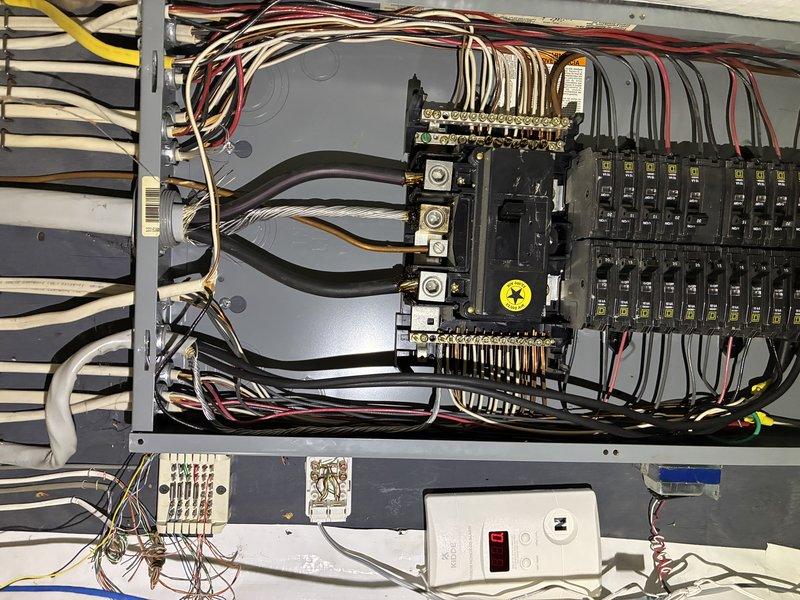 Responded to no power emergency call affecting HVAC system. Upon arrival, inspected main electrical panel and discovered tripped breaker supplying power to air conditioning unit. Verified all internal panel connections were secure, checked grounding bars for proper continuity, and confirmed no signs of electrical damage or overheating at breaker terminals. Reset affected circuit breaker and restored power to outdoor condensing unit. Inspected exterior disconnect box and refrigerant line connections for any physical damage or electrical issues. Tested system operation and confirmed proper voltage supply to HVAC equipment. System restored to full operational status with cooling function working normally.