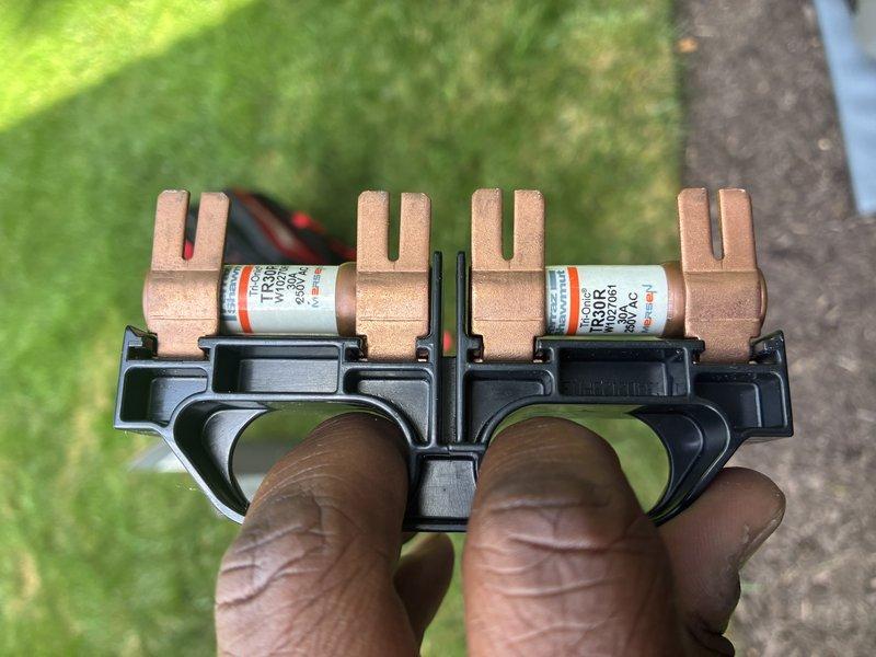 Completed MVP cooling maintenance visit on 5-year-old system. Performed electrical diagnostics using clamp meter, recording amperage draw of 260.3 amps on unit components. Inspected and removed fuse block assembly containing four copper fuses for visual examination, confirming proper electrical protection components were in place and functional.