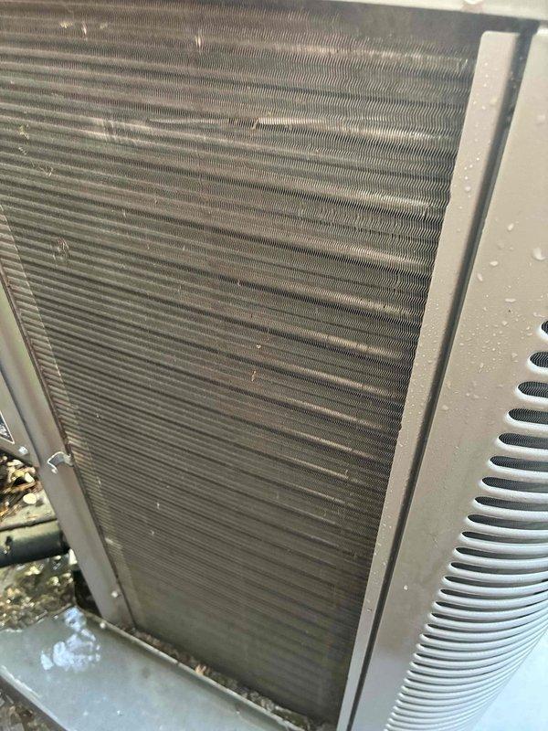 Completed MVP cooling maintenance visit on 9-year-old Lennox residential air conditioning system. Performed comprehensive inspection of outdoor condenser unit, noting significant accumulation of dirt, dust, and debris throughout condenser coil fins. Cleaned condenser coils to restore proper airflow and heat transfer efficiency. Verified electrical connections at disconnect box, inspected refrigerant lines, and confirmed unit operational status. System returned to normal service with improved cooling performance.