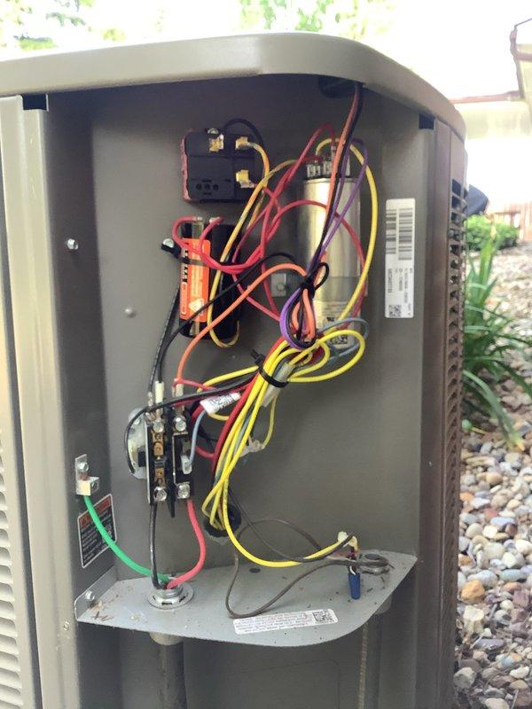Completed MVP recurring cooling maintenance visit on residential air conditioning system. Performed comprehensive inspection of outdoor condenser unit, verified proper operation of contactor and electrical connections, and documented system conditions with photos showing unit installation on concrete pad with proper clearances and electrical disconnect box with active testing of components. Customer confirmed continuation of service agreement following invoice receipt.