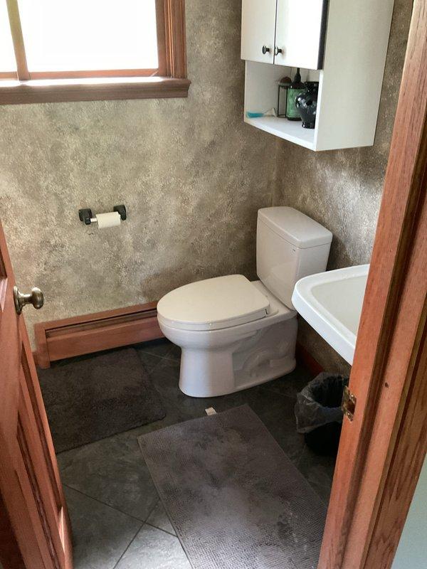 Removed and hauled away existing toilet from bathroom. Installed new customer-supplied toilet onto existing brass toilet flange, ensuring proper seal and secure mounting. Verified functionality and left work area clean with all fixtures operational.