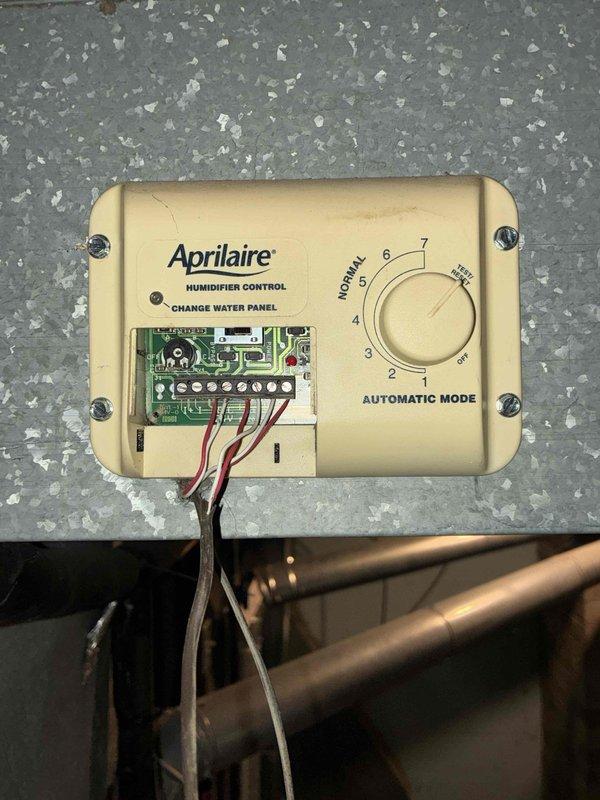 Completed preventive maintenance cooling visit on two HVAC systems. Performed electrical diagnostics using clamp meter to verify amperage draws and system performance. Inspected and serviced Aprilaire humidifier control system, checked circuit board operation and wiring connections, and verified proper function of automatic humidity control settings.