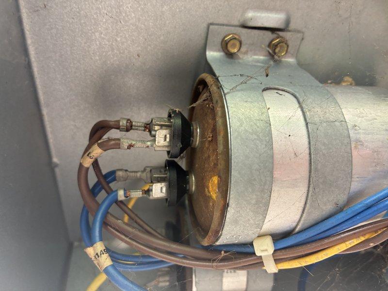 Responded to no-cool complaint on 12-year-old residential air conditioning system with thermostat displaying system malfunction error. Upon inspection, diagnosed failed dual run capacitor on outdoor condensing unit, which was preventing compressor from starting while allowing fan motor to operate. Replaced defective capacitor with properly rated replacement, verified correct microfarad ratings for both compressor and condenser fan motor circuits, and confirmed system returned to normal cooling operation with proper amperage draws and temperature differential across evaporator coil.