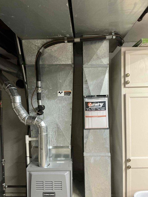 Provided comprehensive estimate for complete central air conditioning system replacement for 2,000 square foot residential property. Evaluated existing Concord air handler installation in basement mechanical room and outdoor condenser unit positioned against house exterior. Documented current system configuration including ductwork connections and equipment placement, noting outdoor unit repositioning requirements for optimal performance and accessibility. Presented equipment options and installation specifications for new central AC system appropriate for property size and existing infrastructure.