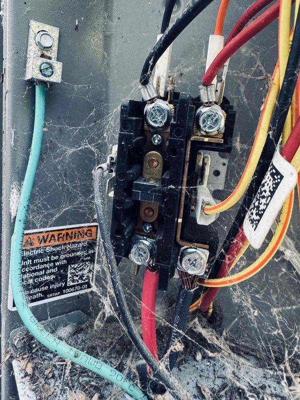 Responded to no cooling complaint on 8-year-old air conditioning system. Upon arrival, confirmed condenser unit was not operating and outdoor fan was not spinning. Performed diagnostic testing using multimeter to check electrical connections at the condenser terminal block. Identified faulty electrical connection or component preventing power delivery to the condenser fan motor and compressor. Inspected terminal block assembly, wiring connections, and associated electrical components for signs of failure, corrosion, or damage.