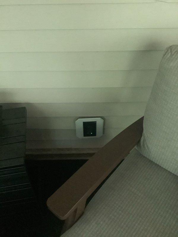 Installed two new GFCI-protected outlets in sunroom, one on each side of sliding glass door, mounted in exterior-rated surface mount siding blocks. Pulled power from existing interior outlet adjacent to door and from utility room outlet beneath workbench, converting junction box to old work style as needed to facilitate wire routing through exterior wall. Replaced malfunctioning GFCI receptacle and damaged weatherproof cover on deck, verified device was wired line-side only with no downstream load protection.
