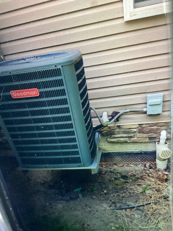 Performed preventative maintenance on 12-year-old Goodman air conditioning system. Completed standard tune-up procedures including inspection of outdoor condensing unit, verification of refrigerant levels, electrical component testing, and air filter evaluation. Unit showing age-appropriate wear with some exterior weathering and debris accumulation around base; cleaned area and confirmed system operational. Addressed minor maintenance concerns and provided recommendations for continued reliable performance.