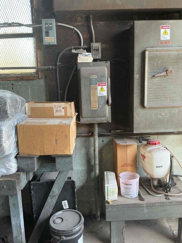 Responded to service call to inspect electrical system supporting air compressor operation in industrial facility. Upon arrival, accessed mechanical room housing 480-volt disconnect equipment and associated electrical infrastructure. Performed comprehensive electrical inspection of all components in the circuit, including disconnect box, conduit runs, and power distribution feeding the air compressor system. Verified proper voltage levels, checked for secure connections at all termination points, and confirmed appropriate overcurrent protection devices were in place. Inspected flexible metallic conduit routing and mounting hardware for code compliance and physical integrity. Evaluated electrical panel condition and verified proper labeling and warning signage present on high-voltage equipment. All electrical components supporting the air compressor were found to be functioning within normal parameters with no immediate safety concerns or code violations identified.