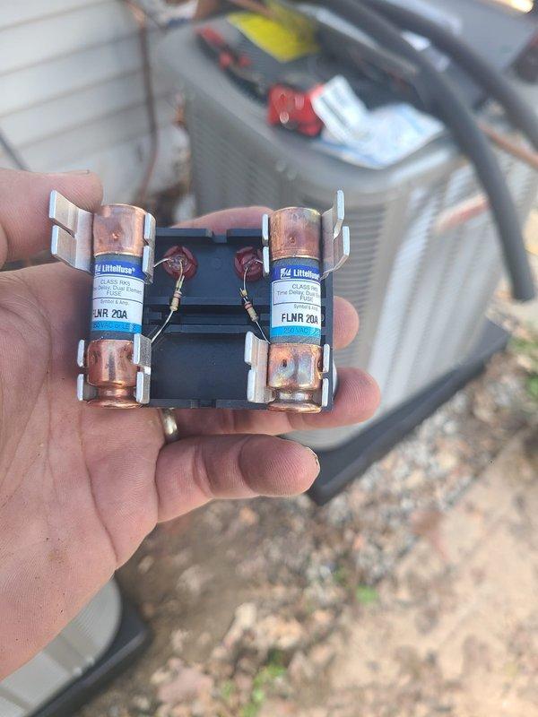 Completed installation of dual-zone HVAC system consisting of two 90% efficiency furnaces and two air conditioning units. Installed new electrical disconnects with FLNR-rated fuses (20A and 30A) for proper overcurrent protection on both outdoor condensing units, ensuring code-compliant power supply to all equipment.