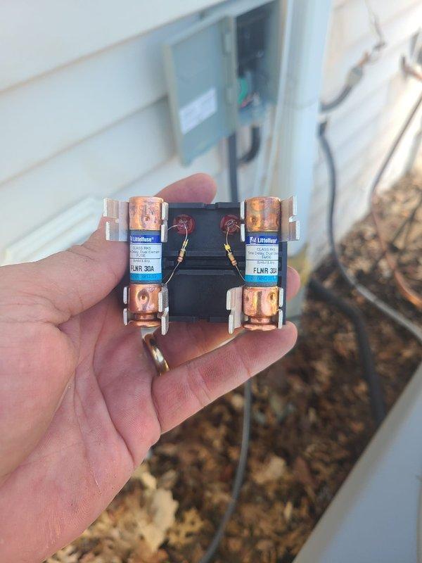 Completed installation of dual-zone HVAC system consisting of two 90% efficiency furnaces and two air conditioning units. Installed new electrical disconnects with FLNR-rated fuses (20A and 30A) for proper overcurrent protection on both outdoor condensing units, ensuring code-compliant power supply to all equipment.