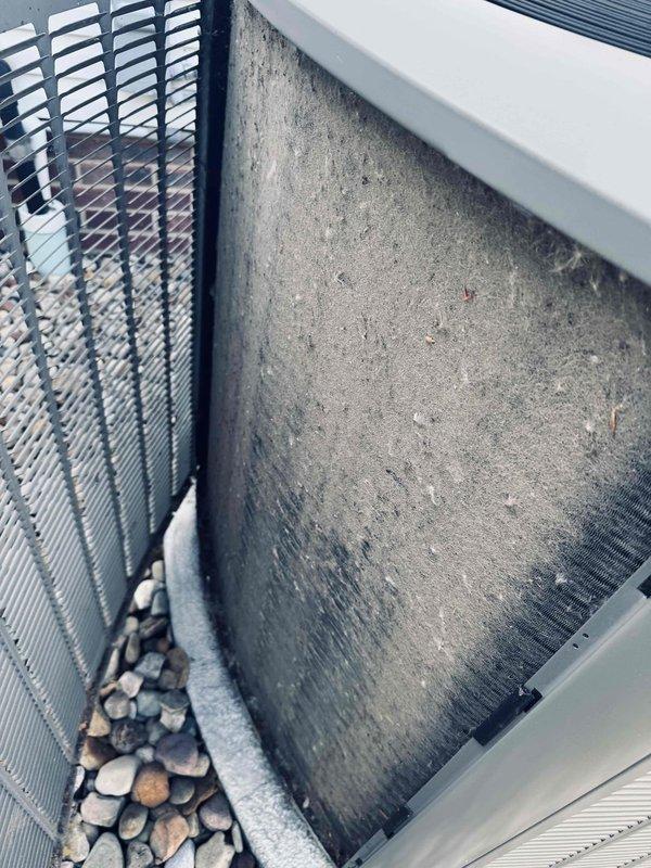 Responded to no cooling complaint on 7-year-old residential air conditioning system. Upon inspection, discovered severely clogged air filter restricting airflow to evaporator coil. Replaced dirty filter with new unit, restoring proper system operation and cooling capacity.