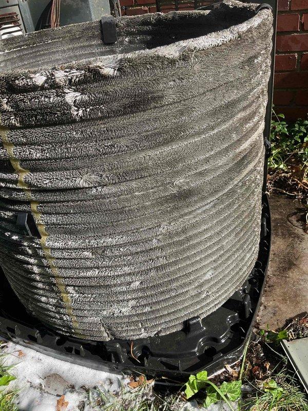Responded to no-cooling call on 15-year-old outdoor condensing unit. Upon inspection, found condenser coil heavily impacted with dust, dirt, lint, and debris accumulation throughout all fin surfaces, severely restricting airflow and preventing proper heat transfer. Performed thorough coil cleaning to remove buildup and restore unit to operational condition. Unit tested and confirmed cooling properly after service. Advised customer of unit age and recommended monitoring for future performance issues.