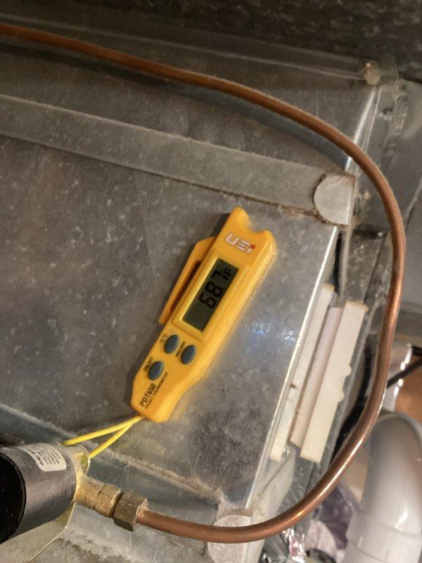 Completed scheduled MVP cooling maintenance on 5-year-old system. Performed comprehensive inspection of indoor air handler unit, checking refrigerant lines and measuring system temperatures with digital instrumentation, which indicated 68.6°F reading. Inspected outdoor condensing unit, verifying proper operation of compressor and fan assembly. All components functioning within normal parameters, system operating efficiently with no repairs required.