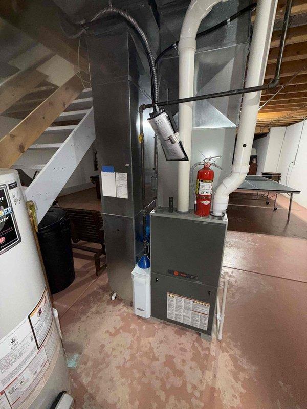 Completed preventive maintenance cooling visit on 14-year-old residential HVAC system. Performed comprehensive inspection of indoor furnace unit located in basement mechanical room and outdoor condenser unit positioned on exterior concrete pad. Inspected all accessible components including ductwork connections, electrical connections, and refrigerant lines. Verified proper operation of condenser fan and compressor, checked clearances around outdoor unit, and confirmed adequate airflow through louvered panels. System operating within normal parameters at time of service.