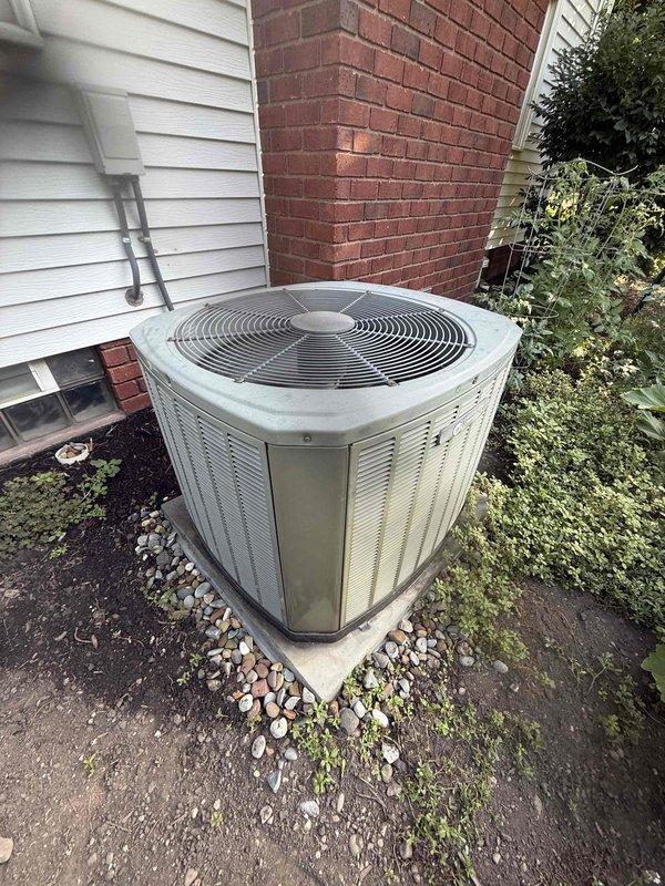 Completed preventive maintenance cooling visit on 14-year-old residential HVAC system. Performed comprehensive inspection of indoor furnace unit located in basement mechanical room and outdoor condenser unit positioned on exterior concrete pad. Inspected all accessible components including ductwork connections, electrical connections, and refrigerant lines. Verified proper operation of condenser fan and compressor, checked clearances around outdoor unit, and confirmed adequate airflow through louvered panels. System operating within normal parameters at time of service.