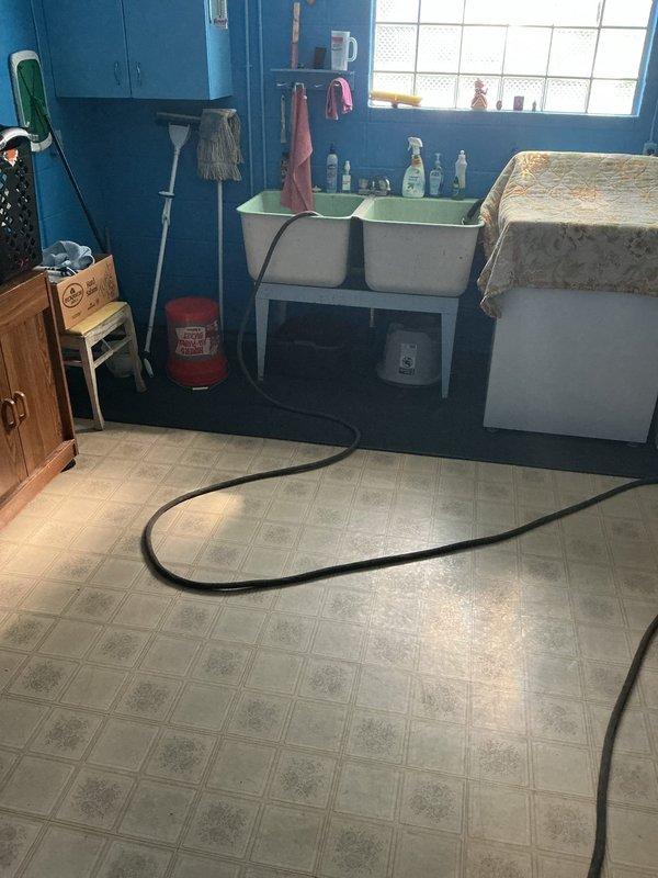 Performed routine maintenance flush on a 4-year-old tanked water heater located in basement utility closet. Drained sediment buildup from tank using hose routed through laundry area to floor drain, restored unit to optimal operating condition, and verified proper function upon completion.