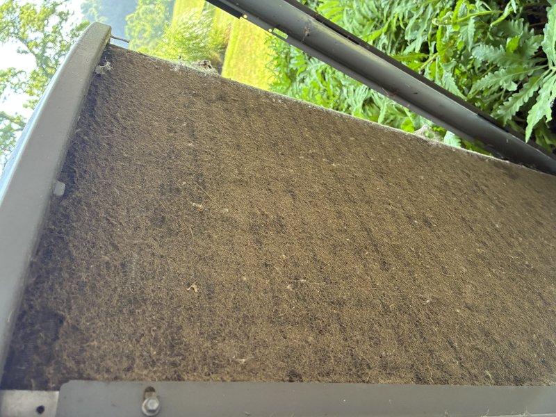 Completed scheduled five-year recurring maintenance service on residential air conditioning system. Inspected evaporator coil assembly and condenser components, documenting conditions through photographs. Found air filter heavily saturated with dust and debris causing significant airflow restriction; replaced filter to restore proper system airflow and efficiency. All HVAC components inspected and system confirmed operational.