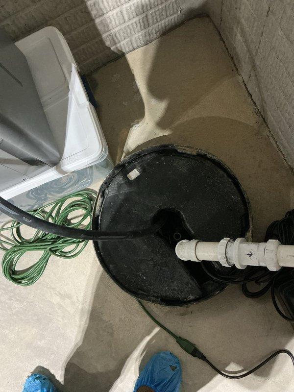 Replaced existing sump pump system with a Level 2 all-in-one primary and battery backup sump pump assembly to provide continued operation during power outages. Removed old pump from basin, installed new integrated system with battery backup unit, and configured all electrical connections and discharge piping. Tested primary pump operation and battery backup functionality to ensure proper automatic switching during power loss scenarios.