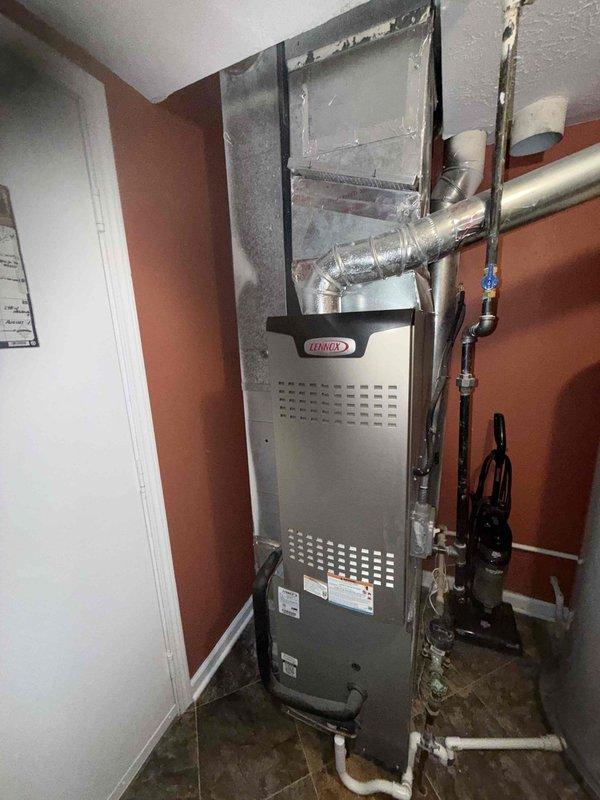 Performed routine preventive maintenance on Lennox air conditioning system less than one year old. Inspected outdoor condenser unit and indoor furnace, verified proper operation of all components, checked refrigerant levels, cleaned coils as needed, and confirmed system functionality with no issues found.
