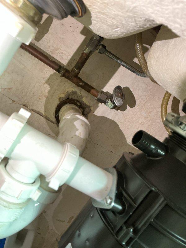 Responded to service call for leaking kitchen sink and bathroom sink. Upon inspection, identified deteriorated supply line connections and corroded shut-off valves beneath fixtures causing active water leaks. The aging metal plumbing components showed significant oxidation and mineral buildup compromising seal integrity at compression fittings.

Performed necessary repairs by replacing faulty compression fittings and tightening loose connections at supply lines. Addressed corroded shut-off valve connections to restore proper function and eliminate water seepage. Verified all drain line connections at white PVC assembly were secure with no signs of leakage. Tested both kitchen and bathroom sink fixtures under full water pressure to confirm successful repair and proper drainage. All leaks resolved and systems restored to normal operation.