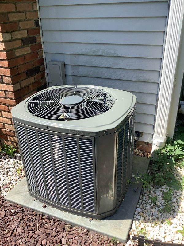 # HVAC Service Completed

Responded to no-cooling call on 9-year-old Trane XR13 3.5-ton air conditioning system. Customer reported complete system failure with outdoor condenser fan not operating, no compressor noise, and no airflow from supply vents. 

Upon arrival, performed visual inspection of outdoor condenser unit and indoor air handler. Verified power supply to equipment and checked thermostat settings. Tested electrical connections at disconnect box and confirmed 240V supply to condensing unit. 

Diagnostic testing revealed failed dual run capacitor preventing condenser fan motor and compressor from starting. Measured capacitance values showing capacitor completely out of specification. Removed defective capacitor and installed new OEM-equivalent dual run capacitor with proper microfarad ratings for both fan motor and compressor circuits.

Restored power to system and verified proper startup sequence. Confirmed condenser fan motor spinning at correct speed and compressor engagi
