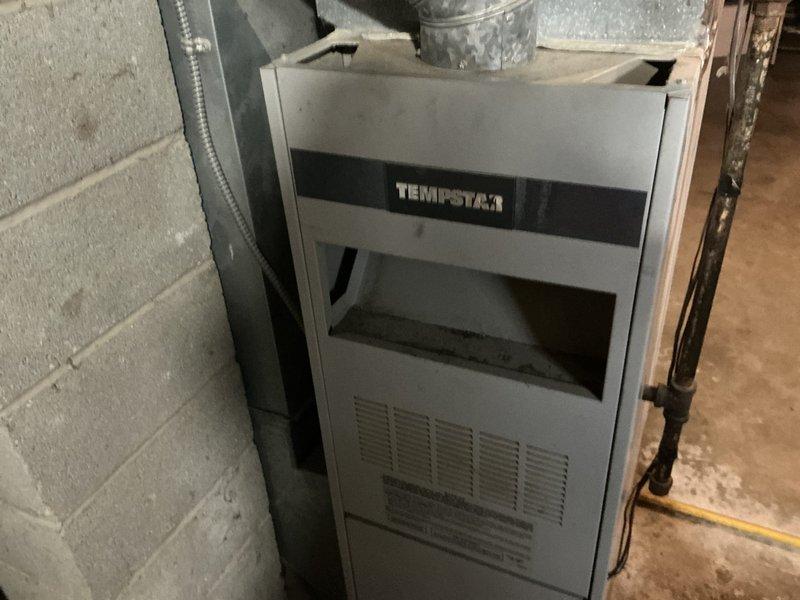 Conducted comprehensive HVAC system assessment for central air conditioning replacement estimate at residential property. Existing Tempstar furnace and aged ductwork system were evaluated in basement utility area, with documentation of current equipment condition and infrastructure. Customer requires complete air conditioning system replacement following unit failure from previous year, with financing options to be provided for new installation.
