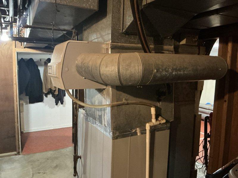 Conducted comprehensive HVAC system assessment for central air conditioning replacement estimate at residential property. Existing Tempstar furnace and aged ductwork system were evaluated in basement utility area, with documentation of current equipment condition and infrastructure. Customer requires complete air conditioning system replacement following unit failure from previous year, with financing options to be provided for new installation.