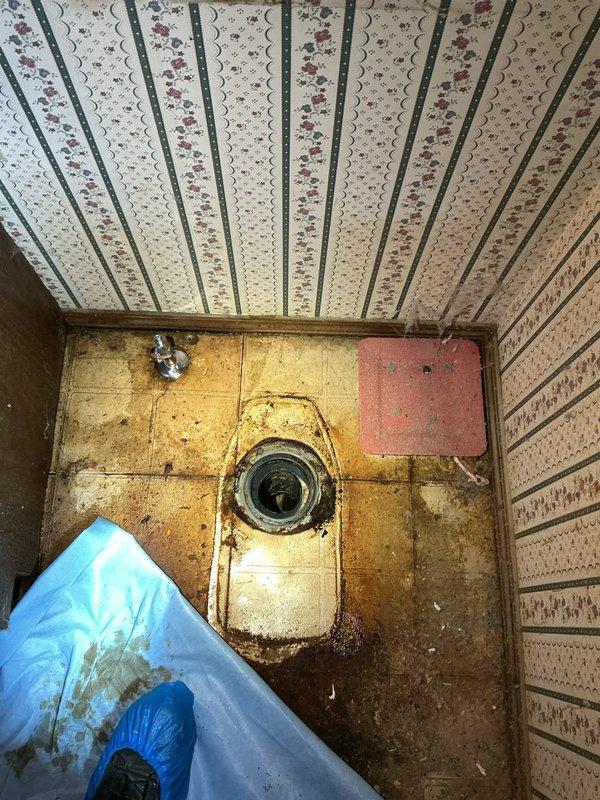 Removed and disposed of existing deteriorated toilet fixture showing severe staining and discoloration. Installed new American Standard Champion Pro toilet with round bowl and standard height configuration. Replaced existing water supply shut-off valve with new shut-off on the water line to ensure proper function and code compliance. Hauled away old toilet and debris from the premises upon completion.