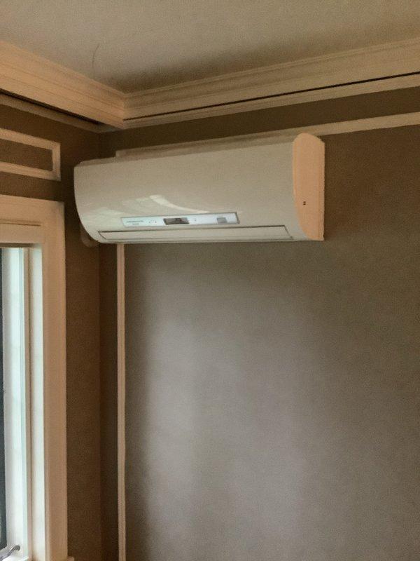 Completed installation of a 1-to-1 Mitsubishi ductless mini-split system. Mounted indoor evaporator unit on interior wall near ceiling with proper clearances and secure bracket installation, installed outdoor condensing unit on concrete pad with appropriate spacing from building exterior, and ran refrigerant lines and electrical connections between units. System tested and verified operational upon completion.