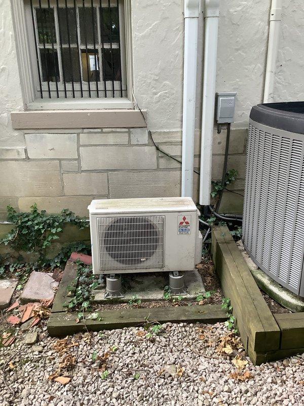 Completed installation of a 1-to-1 Mitsubishi ductless mini-split system. Mounted indoor evaporator unit on interior wall near ceiling with proper clearances and secure bracket installation, installed outdoor condensing unit on concrete pad with appropriate spacing from building exterior, and ran refrigerant lines and electrical connections between units. System tested and verified operational upon completion.