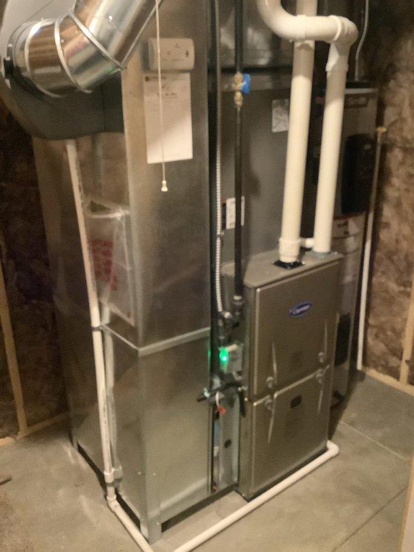 Performed comprehensive diagnostic evaluation on 14+ year old Carrier air conditioning system that failed to cool following recent furnace replacement by another contractor. Upon arrival, conducted thorough inspection of outdoor condenser unit and indoor air handler components. Verified proper power supply to condenser unit and checked electrical connections at disconnect boxes. Measured refrigerant pressures and temperatures to assess system charge and operational performance.

Inspected condenser coil condition, fan motor operation, and compressor functionality. Evaluated airflow through outdoor unit and verified fan motor capacitor values. Checked indoor evaporator coil accessibility and condition through furnace cabinet. Tested thermostat operation and verified proper signal communication between indoor and outdoor units. Examined refrigerant line set connections at both indoor and outdoor units for proper installation and integrity.

Assessed compatibility between newly installed 