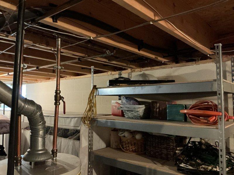 Conducted on-site assessment of existing HVAC system in residential basement to provide replacement estimate. Inspected Lennox furnace unit and associated ductwork, noting moisture present on metallic supply duct. Evaluated current equipment configuration including vertical and horizontal duct runs. Quoted leak search service and provided comprehensive replacement estimate for air conditioning system.
