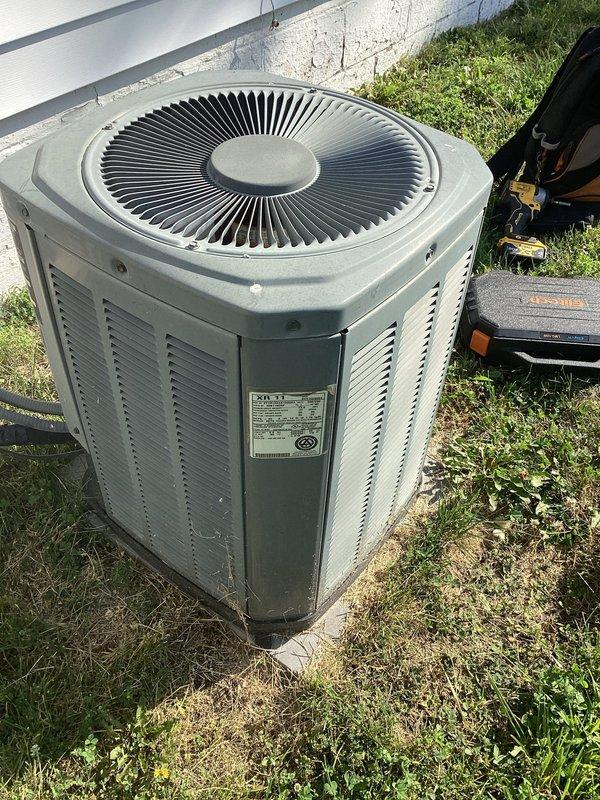 Responded to no cooling complaint on 22-year-old air conditioning system. Upon inspection, found outdoor condenser unit and indoor air handler showing signs of age and wear with visible dirt accumulation on equipment surfaces. Given the advanced age of the system and lack of cooling performance, recommended system replacement due to decreased efficiency and reliability concerns typical of units exceeding their expected service life.