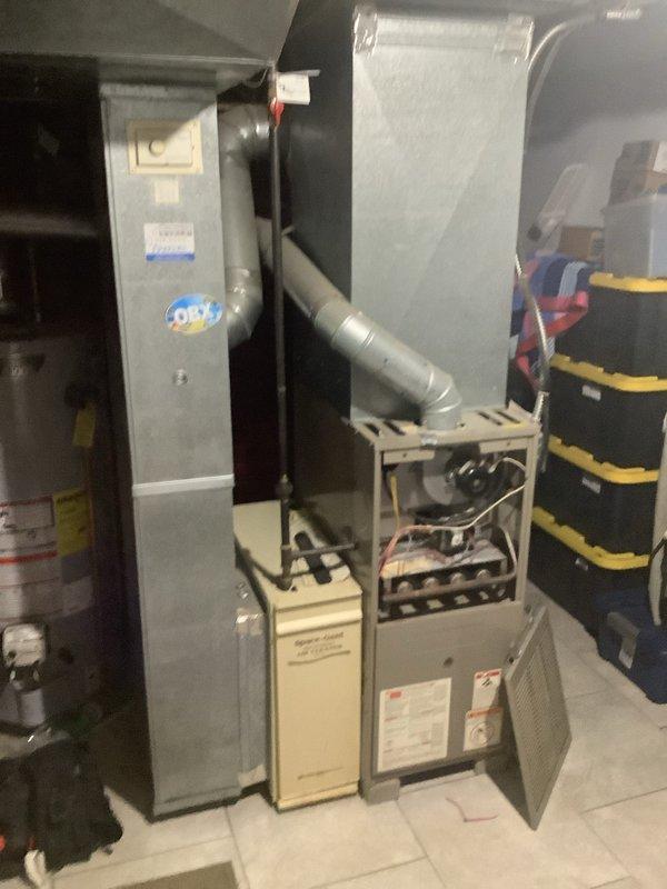 Completed full HVAC system installation including an 80% efficiency furnace and air conditioning system. Installed new air handler unit in basement utility area with proper ductwork connections and mounted outdoor condenser unit against exterior wall with appropriate electrical conduit routing. All equipment tested and operational upon completion.