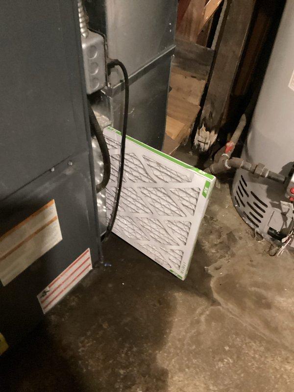 Completed preventive maintenance and inspection on residential air conditioning system. Replaced air filter on air handler unit, inspected evaporator coil showing normal condensation patterns indicating proper operation, and verified refrigerant lines and connections for secure fittings. System operating within normal parameters with no issues detected.