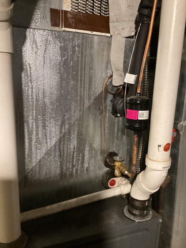 Completed preventive maintenance and inspection on residential air conditioning system. Replaced air filter on air handler unit, inspected evaporator coil showing normal condensation patterns indicating proper operation, and verified refrigerant lines and connections for secure fittings. System operating within normal parameters with no issues detected.