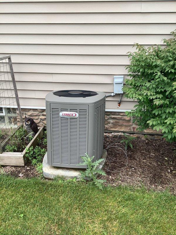 # HVAC Service Completed

Responded to service call for 6-year-old Lennox air conditioning unit experiencing inadequate cooling performance and intermittent Nest thermostat shutdowns occurring daily at consistent intervals for 20-minute durations.

Upon arrival, performed visual inspection of outdoor condensing unit. Found extensive accumulation of dirt, dust, and environmental debris coating exterior panels and restricting airflow through condenser coil louvers. Unit positioned on concrete pad with adequate clearance, though surrounding mulch and vegetation contributed to debris buildup.

Diagnosed primary issue as severely restricted condenser coil airflow due to heavy contamination. The reduced heat transfer capacity caused system to run extended cycles without achieving target temperature, resulting in increased runtime and elevated operating pressures. Thermostat safety shutdowns were attributed to system overheating from inadequate condenser performance.

Performed comprehensive 