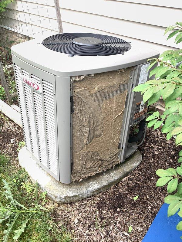 # HVAC Service Completed

Responded to service call for 6-year-old Lennox air conditioning unit experiencing inadequate cooling performance and intermittent Nest thermostat shutdowns occurring daily at consistent intervals for 20-minute durations.

Upon arrival, performed visual inspection of outdoor condensing unit. Found extensive accumulation of dirt, dust, and environmental debris coating exterior panels and restricting airflow through condenser coil louvers. Unit positioned on concrete pad with adequate clearance, though surrounding mulch and vegetation contributed to debris buildup.

Diagnosed primary issue as severely restricted condenser coil airflow due to heavy contamination. The reduced heat transfer capacity caused system to run extended cycles without achieving target temperature, resulting in increased runtime and elevated operating pressures. Thermostat safety shutdowns were attributed to system overheating from inadequate condenser performance.

Performed comprehensive 