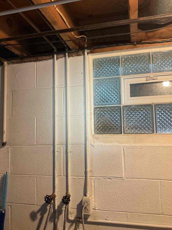 Responded to electrical service call for GFCI outlet installation and wireless thermostat setup. Successfully installed new GFCI outlets in basement area near plumbing infrastructure and glass block window. Completed installation and configuration of customer-provided wireless thermostat in kitchen area, ensuring proper mounting, wiring connections, and system functionality testing.