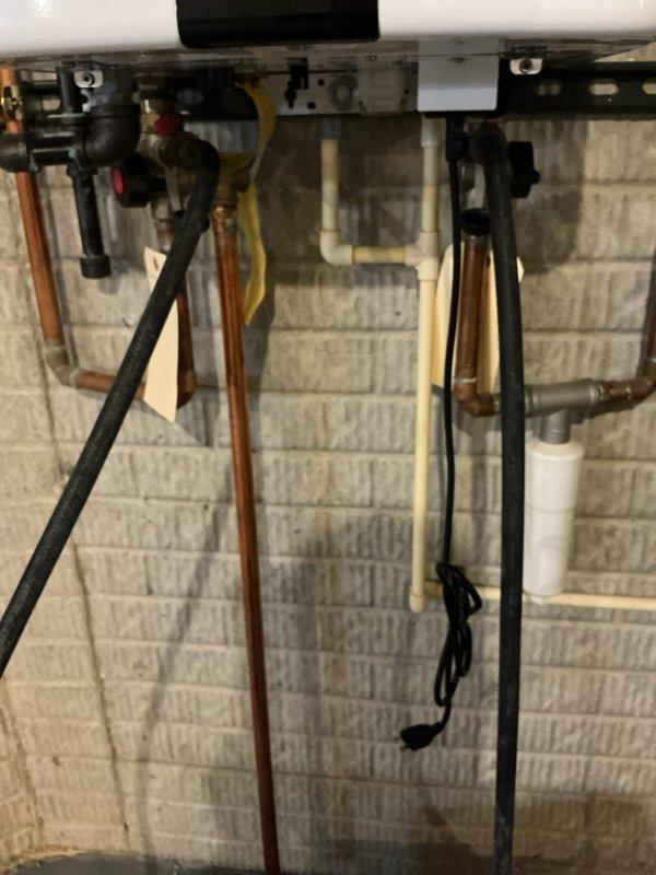 Performed preventative maintenance descaling service on tankless water heater unit. Flushed system with descaling solution to remove mineral buildup and restore optimal heat exchanger efficiency. Verified all connections, gas line, copper water lines, and PVC venting were secure and functioning properly upon completion.