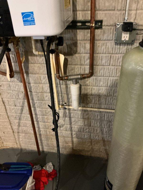Performed preventative maintenance descaling service on tankless water heater unit. Flushed system with descaling solution to remove mineral buildup and restore optimal heat exchanger efficiency. Verified all connections, gas line, copper water lines, and PVC venting were secure and functioning properly upon completion.