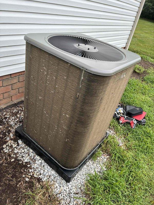 Completed annual preventative maintenance cooling visit on residential air conditioning system. Unit exterior showed significant dirt accumulation and weathering consistent with one year of operation. Performed standard maintenance protocol including inspection of condenser coils, refrigerant line sets, electrical connections, and operational testing. Condenser fins exhibited heavy soiling requiring cleaning to maintain optimal heat transfer efficiency and system performance.