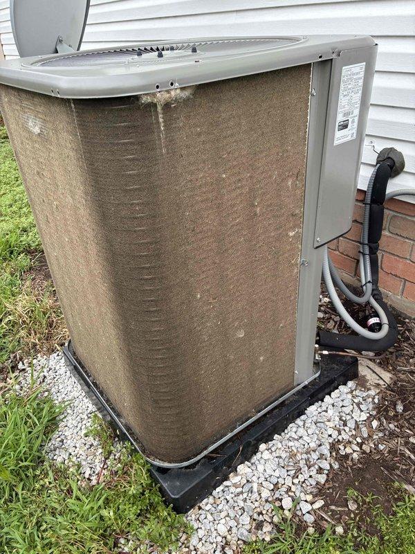Completed annual preventative maintenance cooling visit on residential air conditioning system. Unit exterior showed significant dirt accumulation and weathering consistent with one year of operation. Performed standard maintenance protocol including inspection of condenser coils, refrigerant line sets, electrical connections, and operational testing. Condenser fins exhibited heavy soiling requiring cleaning to maintain optimal heat transfer efficiency and system performance.